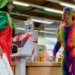 Rainbow-dressed monkey man with “perky prosthetic bum cheeks, sagging nipples and eye-catching dangling dildo” hired by Redbridge Libraries for children’s reading event, reports Jo Bartosch